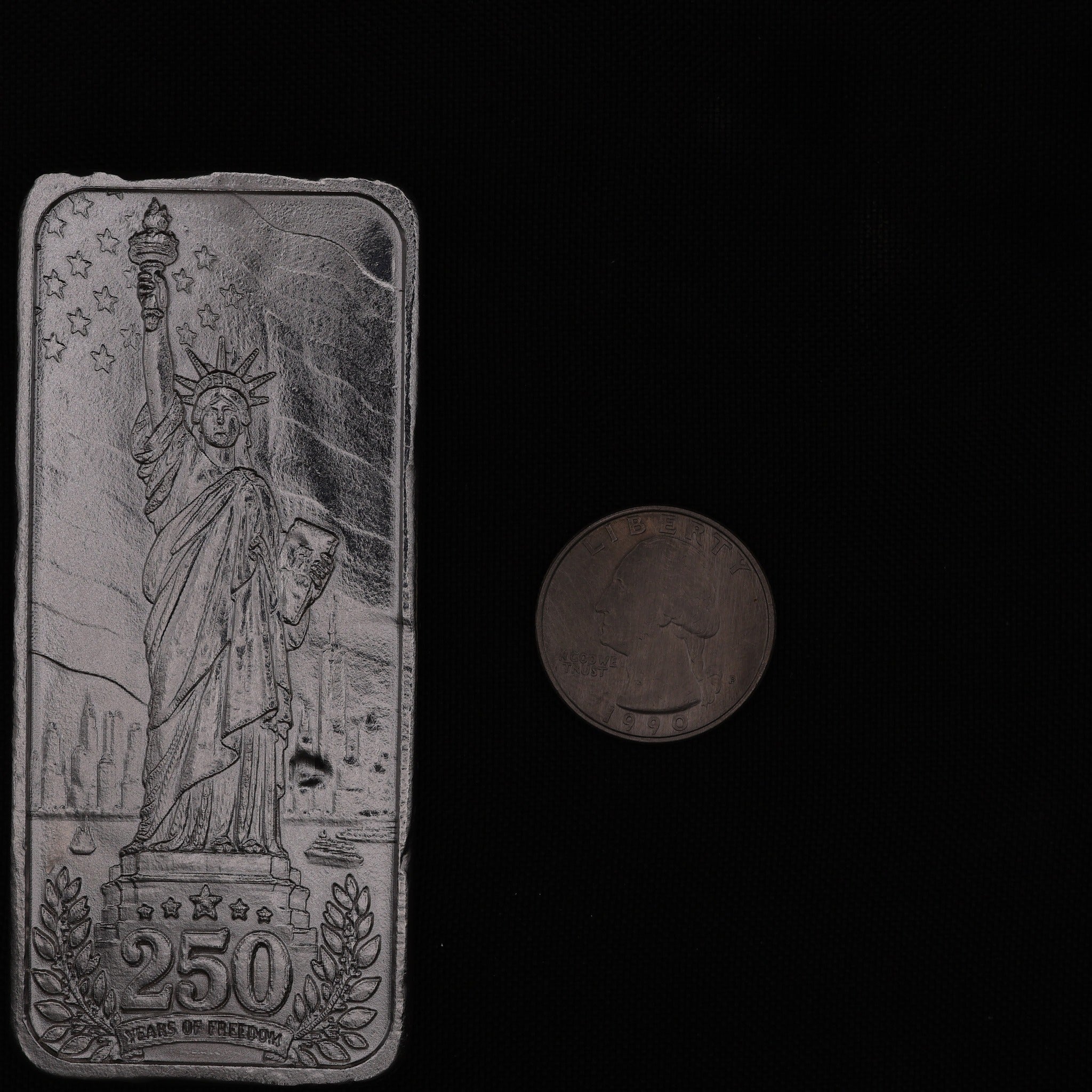 Lady Liberty 250 silver bar with quarter for scale