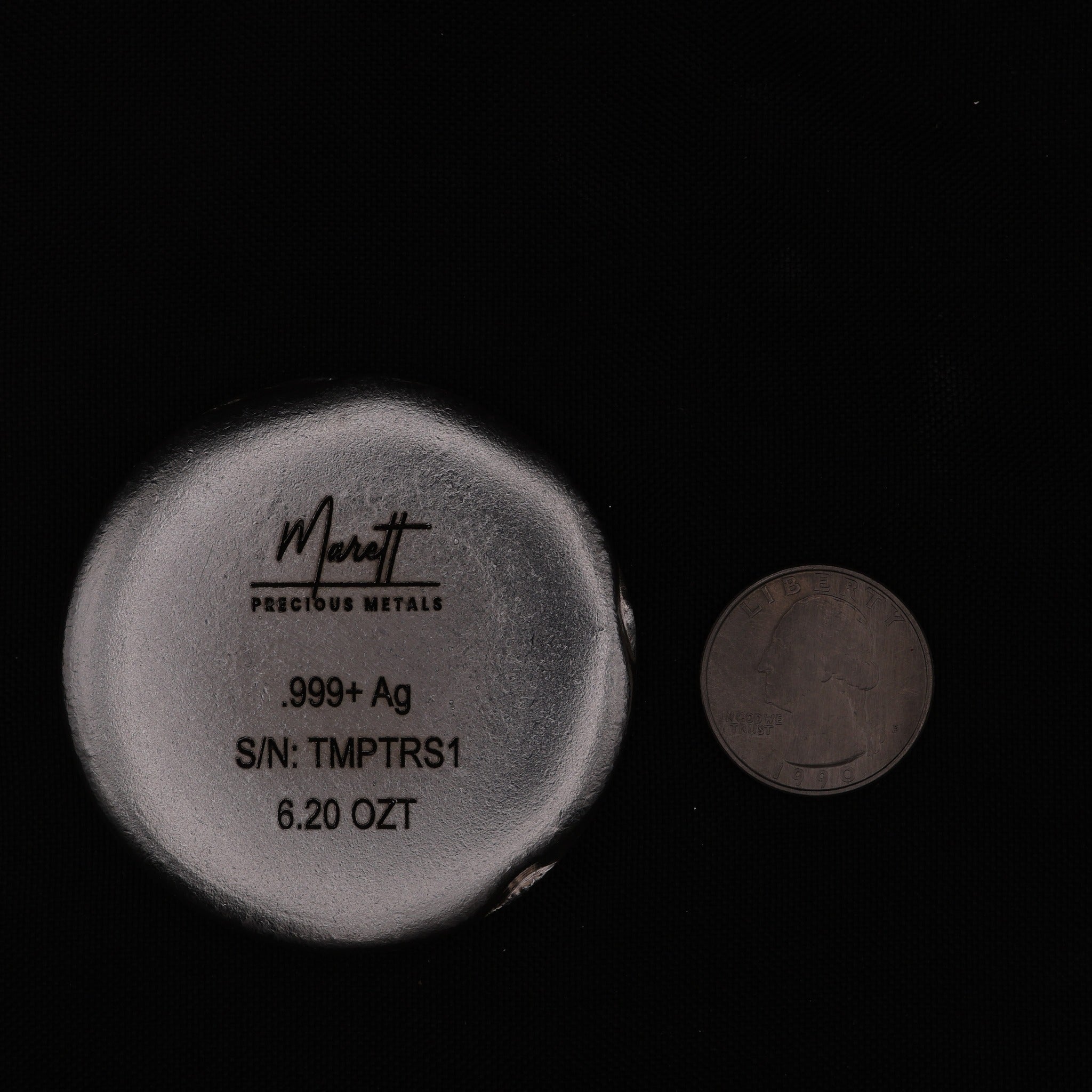 Temptress scale reference beside a quarter